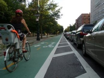Women with Child Riding in the Bike Lane in New York